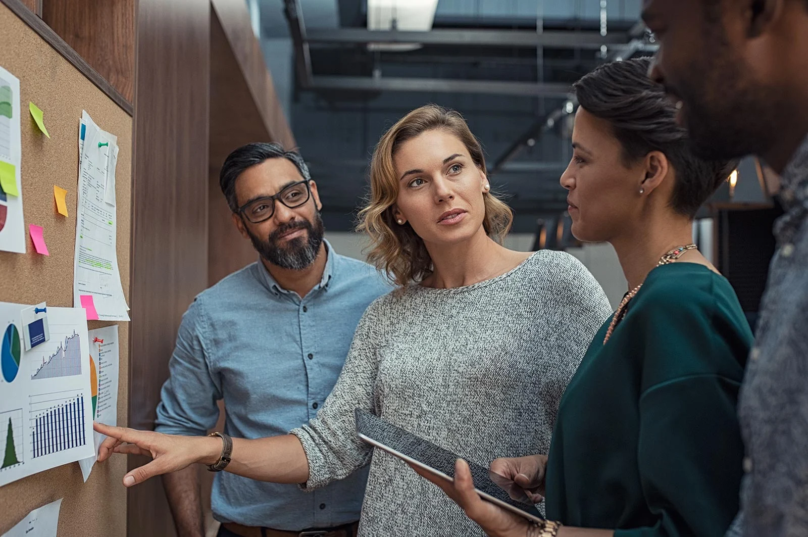 business people discussing graphs