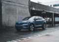 Blue Volvo SUV parked in a modern urban environment showcasing sleek design and urban lifestyle