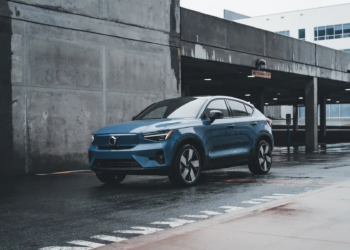 Blue Volvo SUV parked in a modern urban environment showcasing sleek design and urban lifestyle