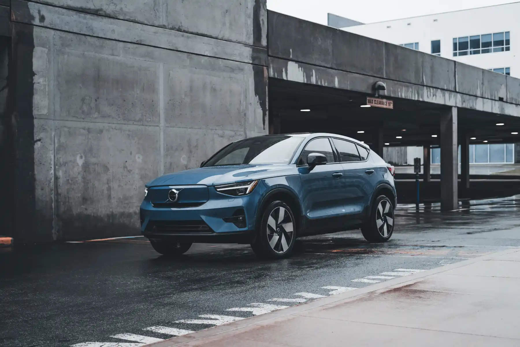 Blue Volvo SUV parked in a modern urban environment showcasing sleek design and urban lifestyle