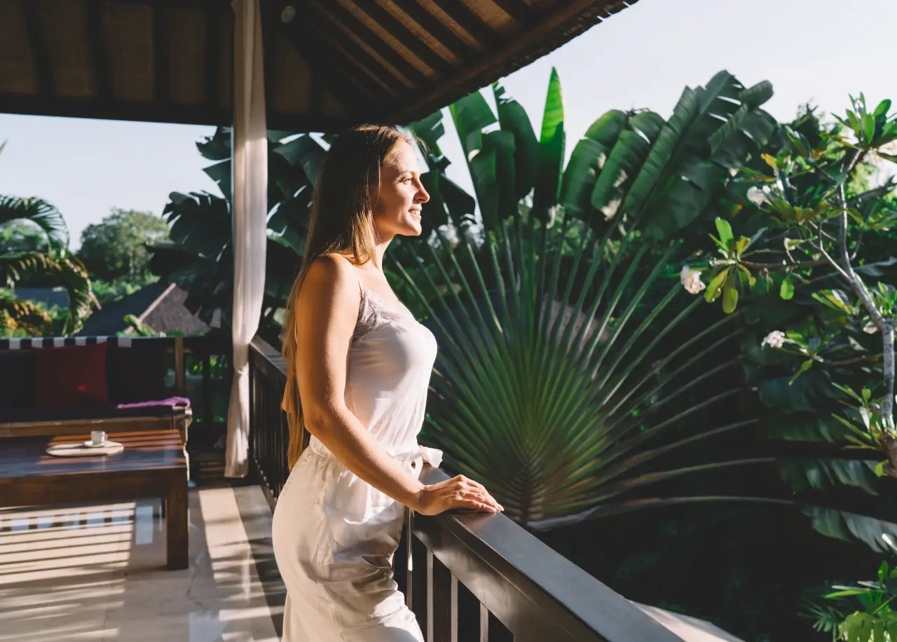 calm woman standing on terrace