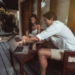 man and woman laptop on verandah