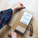 woman preparing online order packing parcel