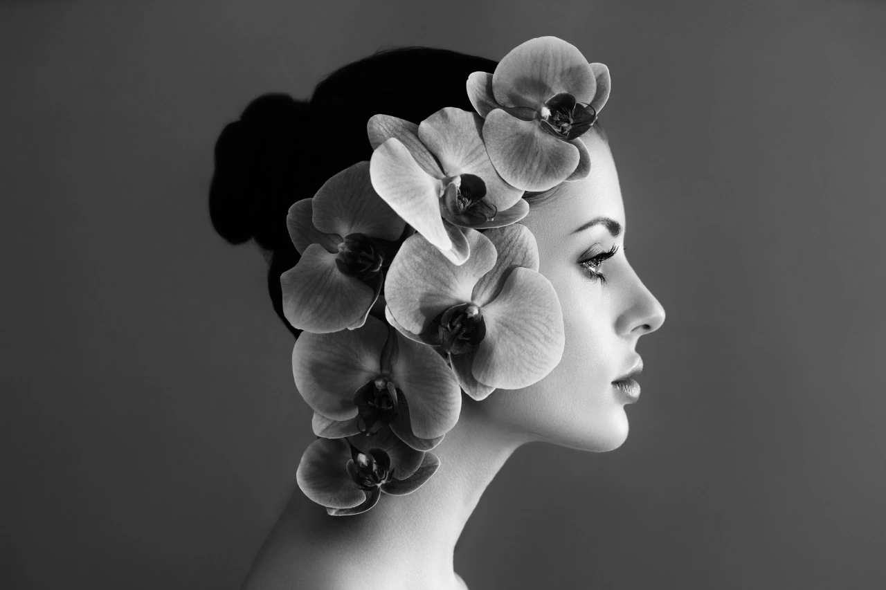 woman profile with flowers in hair