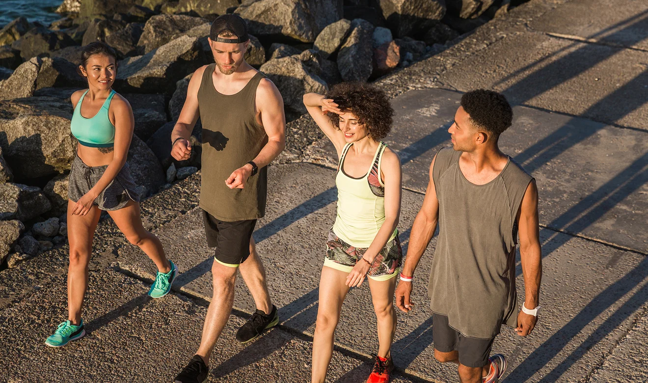 bunch of friends walk in near beach