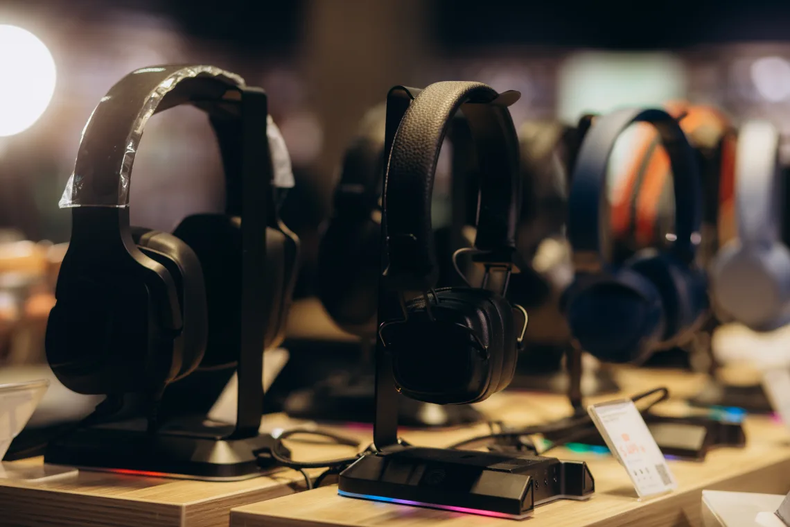 girl buying headphones in audio