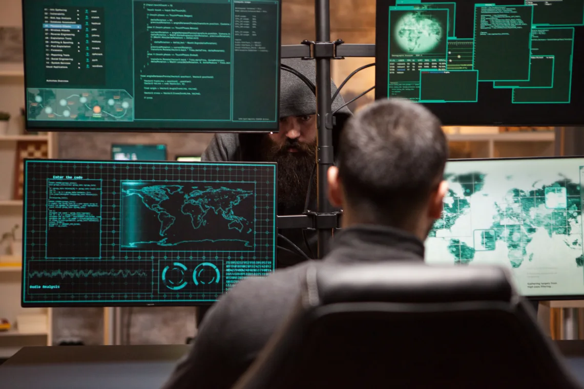 two male hackers hacking into bank